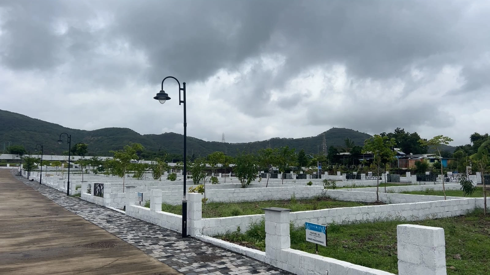 The Vana Estate — developed plots with hill backdrop